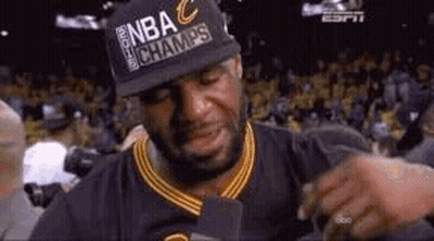 Lebron James Is Crying While Wearing A Hat And Holding A Microphone . GIF