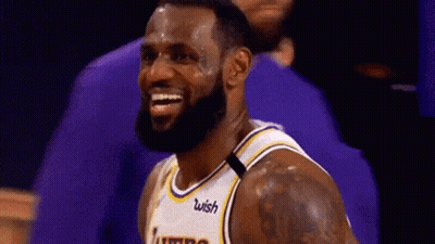 Lebron James Is Smiling While Wearing A Lakers Jersey . GIF