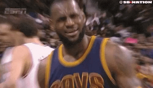 Lebron James Is Wearing A Cavs Jersey And Smiling At The Camera . GIF