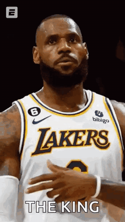 Lebron James Is Wearing A Lakers Jersey And Clapping His Hands During A Game . GIF