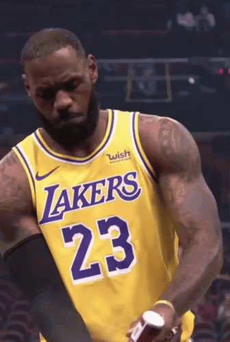 Lebron James Is Wearing A Lakers Jersey With The Number 23 On It GIF