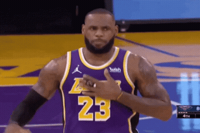 Lebron James Is Wearing A Purple Jersey With The Number 23 On It And Giving A Thumbs Up . GIF