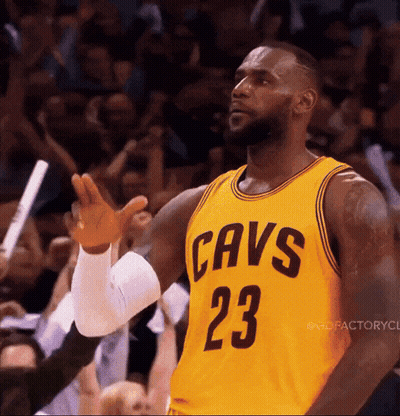 Lebron James Is Wearing A Yellow Jersey With Cavs 23 On It GIF