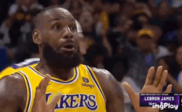Lebron James Is Wearing A Yellow Lakers Jersey And Making A Funny Face . GIF