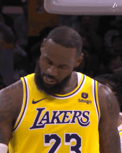 Lebron James Is Wearing A Yellow Lakers Jersey During A Game GIF