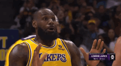 Lebron James Is Wearing A Yellow Lakers Jersey During A Game GIF