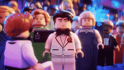 Lego Batman And Robin Standing In City GIF