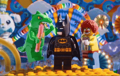 Lego Batman In Front Of Clown And Green Dinosaur GIF