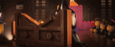 Lego Batman Standing Next to Pink Brick
