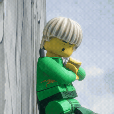 Lego Figure Leaning Against Wooden Wall GIF