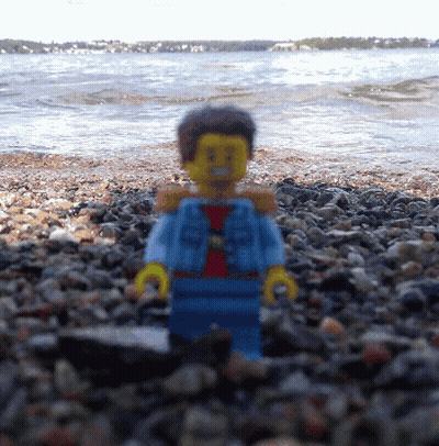 Lego Figure On Rocky Beach GIF