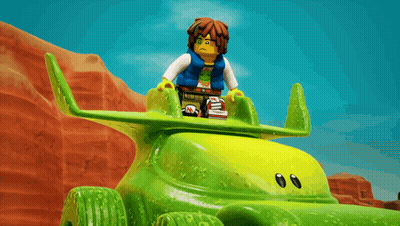 Lego Figure Sitting On Green Toy Car GIF