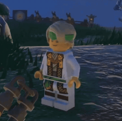 Lego Figure Standing In Grass With Sword GIF