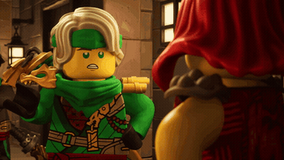 Lego Figure With Green Scarf Next To Another Lego Figure GIF