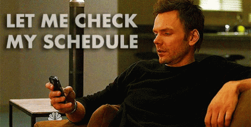 Let Me Check My Schedule Man Holding Phone GIF