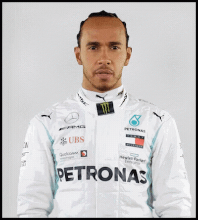 Lewis Hamilton Is Wearing A White Jacket With Logos For Ubs And Petronas GIF