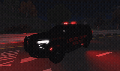 Liberty County Police Car Driving Down Road GIF