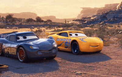 Lightning Mcqueen And Rusteze Are Standing Next To Each Other In The Desert GIF
