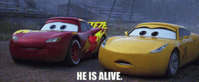 Lightning Mcqueen And Rusteze From The Movie Cars Are Racing On A Track . GIF