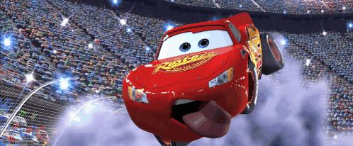 Lightning Mcqueen From Cars Is Flying Through The Air In Front Of A Crowd GIF