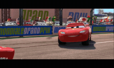 Lightning Mcqueen Is On A Race Track With A Sign That Says Mondiale Grand Prix GIF