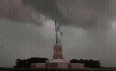 Lightning Strikes Statue Of Liberty During Storm GIF