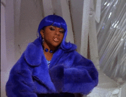 Lil Kim Using Blue Outfit
