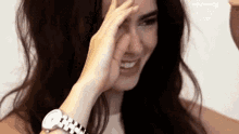 Lily Collins Touching Her Hair While Smiling GIF