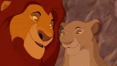 Lion And Lioness Looking At Each Other Smiling GIF