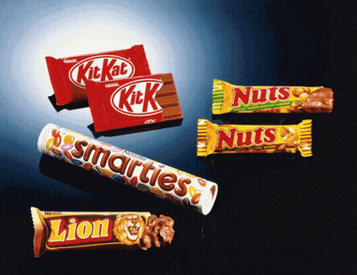 Lion Candy Bar Next To Kit Kat And Nuts Bar GIF