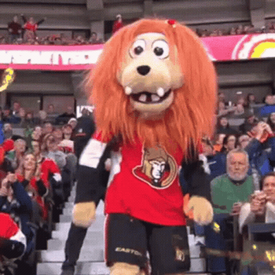 Lion Mascot Dancing In Front Of Crowd GIF