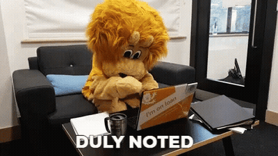 Lion Mascot With Laptop Saying I'm On Loan GIF