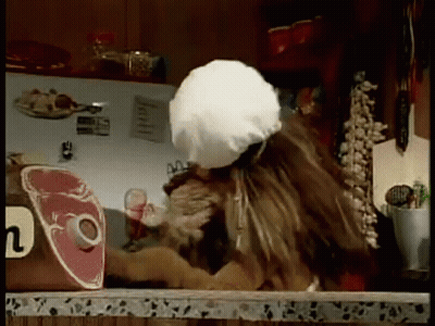 Lion Wearing Chef Hat Reaching For Meat GIF