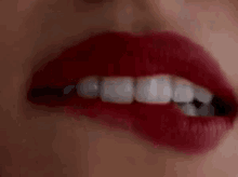 lip-bite-tease-sexy-red-lipstick-b8cjr593ek2dmfmn.gif
