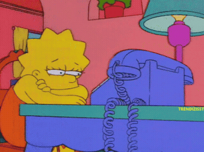 Lisa Simpson Sitting At Desk With Phone GIF