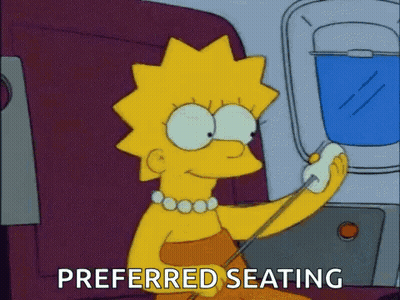 Lisa Simpson Sitting On Airplane Talking On Cell Phone GIF