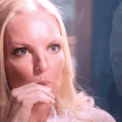 Listening Intently While Sipping Juice GIF