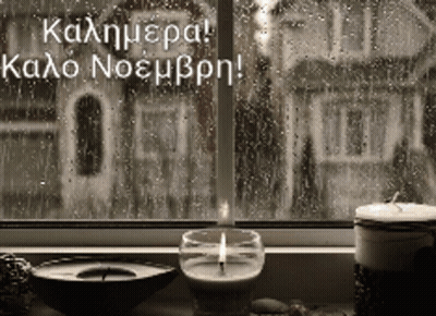 Lit Candle In Front Of Rainy Window GIF