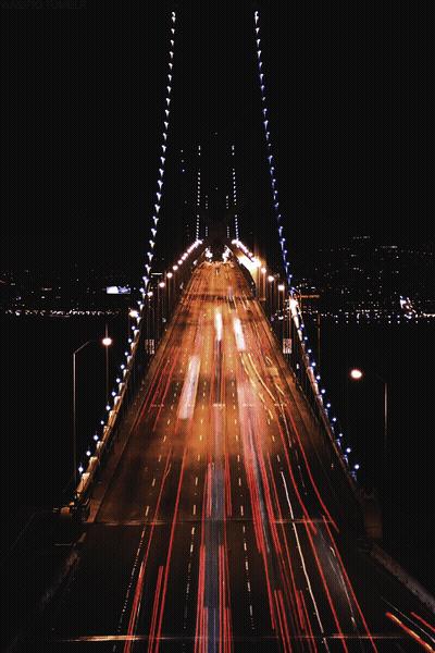 Lit Up Bridge With No Trucks Sign GIF