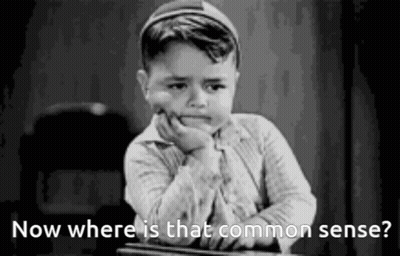 Little Boy At Desk With Hand On Chin Saying Now Where Is That Common Sense GIF
