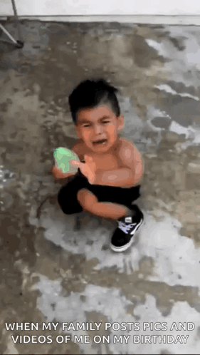 Little Boy Crying Playing With Water Gun GIF