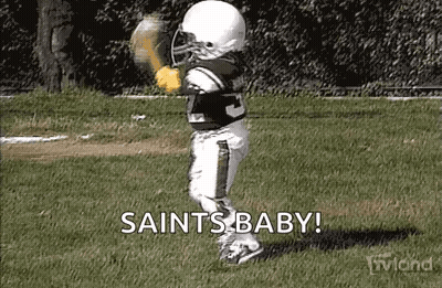 Little Boy Dressed As Football Player Holding Baseball Glove GIF