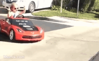 Little Boy Driving Red Toy Car GIF