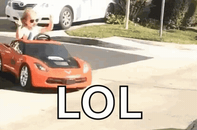 Little Boy Driving Red Toy Car GIF