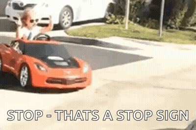 Little Boy Driving Toy Car On Street GIF