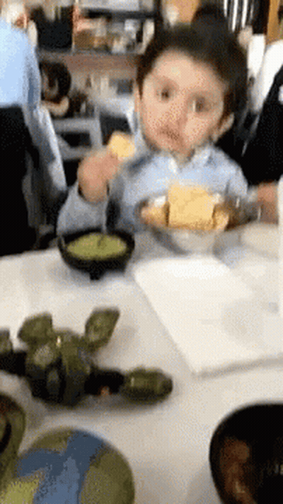 Little Boy Eating Bowl Of Food GIF
