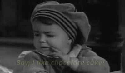 Little Boy Eating Chocolate Cake Saying Boy I Like Chocolate Cake GIF