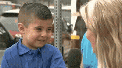 Little Boy In Blue Shirt Talking To Woman GIF