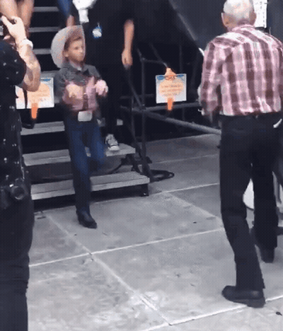 Little Boy In Cowboy Hat On Stairs GIF
