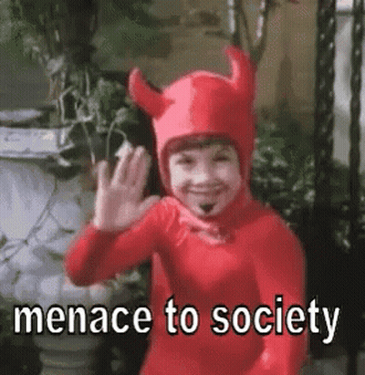 Little Boy In Devil Costume Waving Says Menace To Society GIF